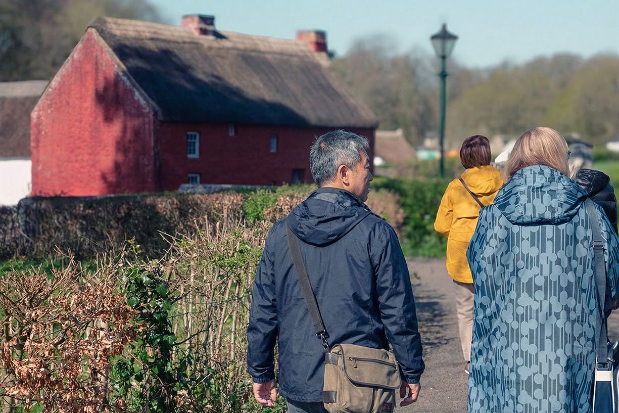 Person creating art at a table with painting supplies